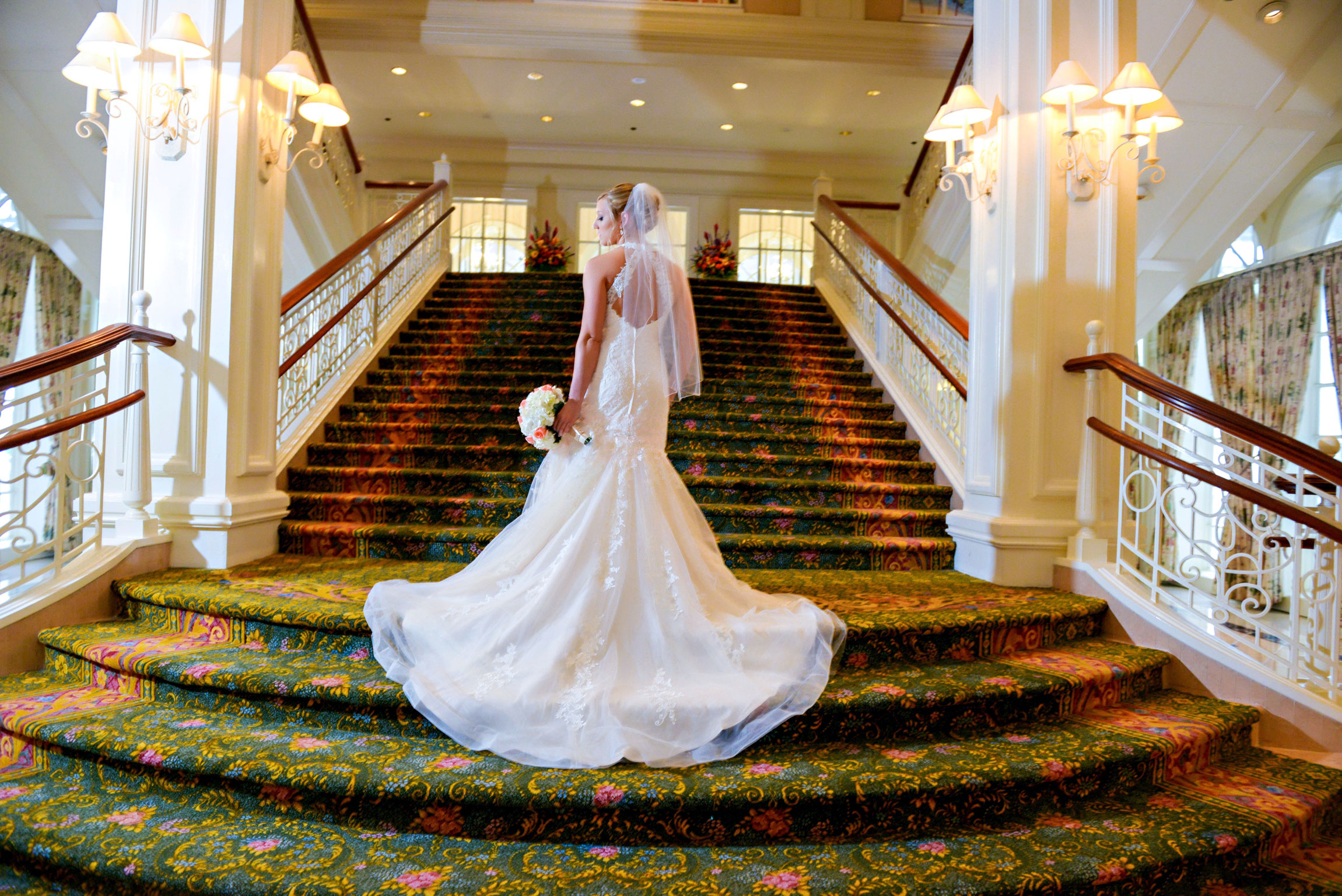 Jordann in wedding dress on Disney's Grand Floridian Grand Staircase.jpg